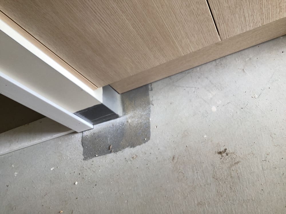 Behind vanity, recorded during a waterproofing inspection in Gleneagle